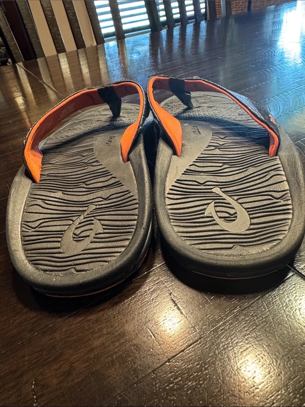 OluKai Men's Black Flip-Flops with Orange Accents